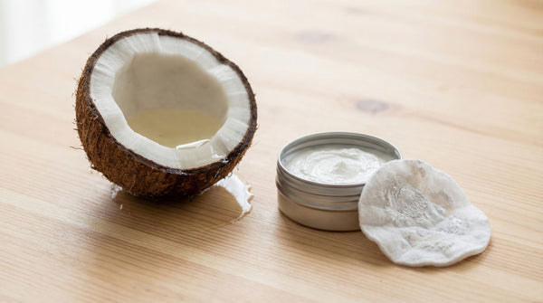 Coconut oil next to mineral sunscreen showing natural sunscreen removal method